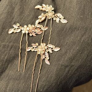 Three rose gold hairpins with crystals worn once